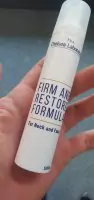 Hand of customer holding firm and restore formula